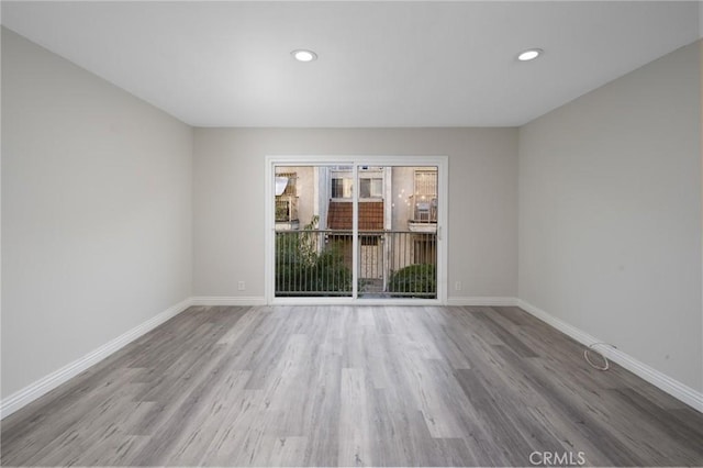 empty room with light hardwood / wood-style floors