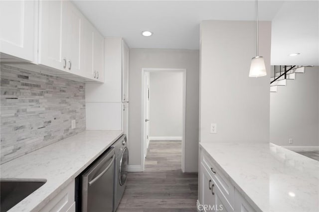 kitchen featuring light stone countertops, white cabinetry, and dark wood-type flooring