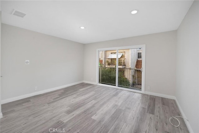 unfurnished room featuring light wood-type flooring