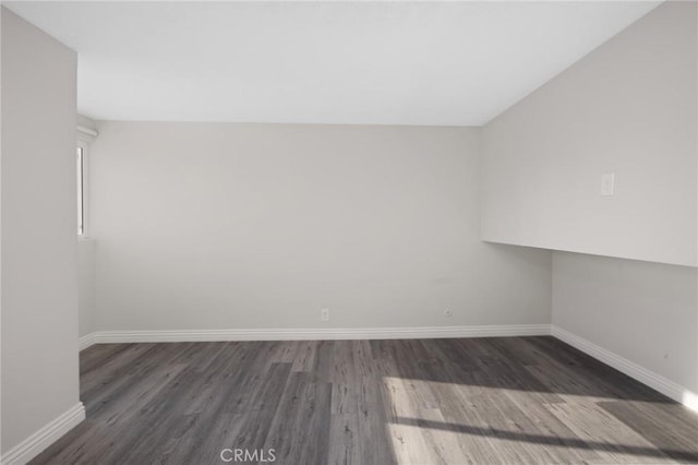 spare room featuring dark hardwood / wood-style floors