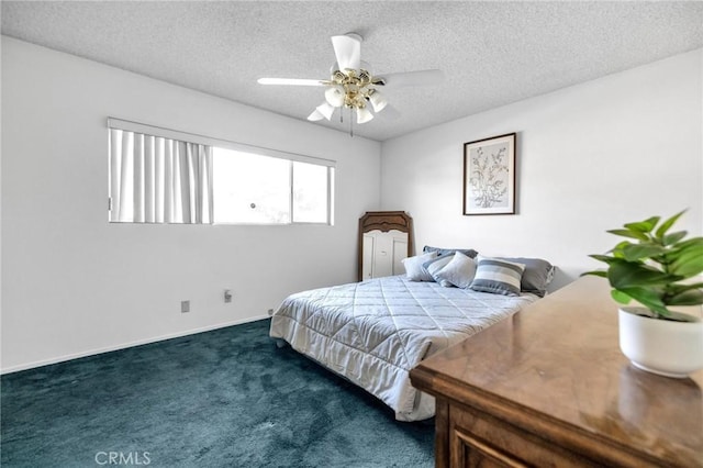 carpeted bedroom with ceiling fan and a textured ceiling