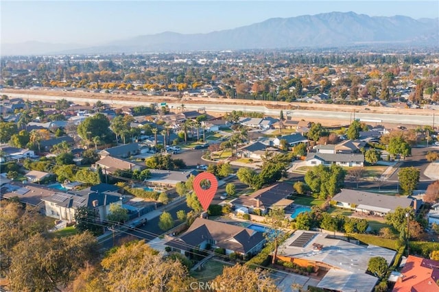 birds eye view of property with a mountain view