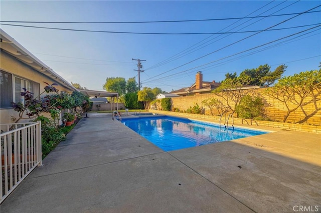 view of pool featuring a patio area