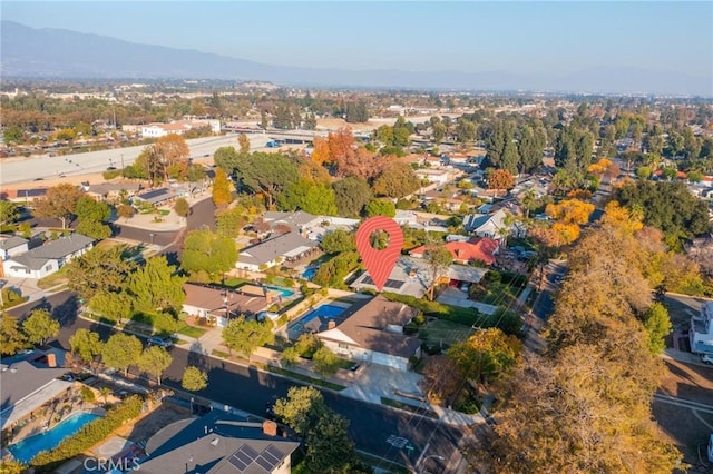 birds eye view of property featuring a mountain view