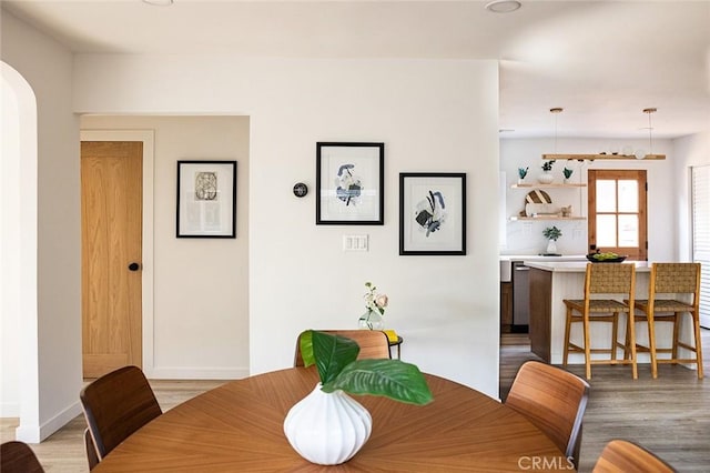 dining space featuring light wood-type flooring