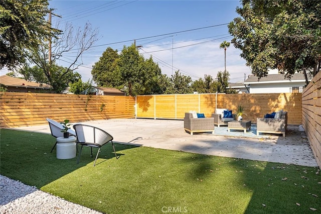 view of yard with an outdoor living space and a patio