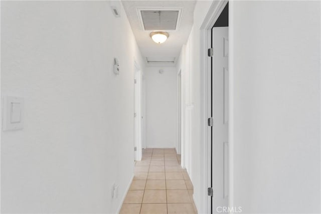 hallway featuring light tile patterned floors