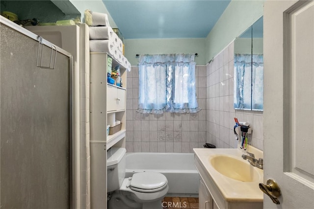 bathroom featuring vanity, toilet, and a shower with door