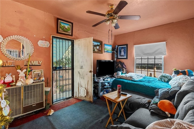 bedroom featuring carpet, ceiling fan, and access to exterior