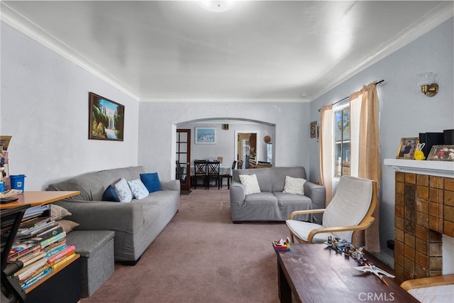 carpeted living room with ornamental molding