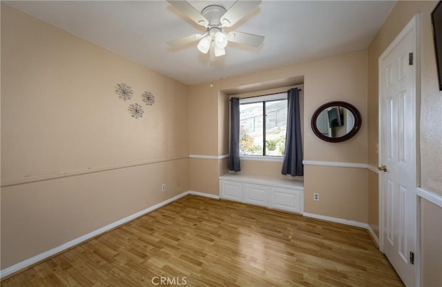 unfurnished room with ceiling fan and light hardwood / wood-style flooring