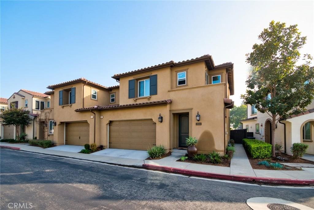 mediterranean / spanish-style home featuring a garage