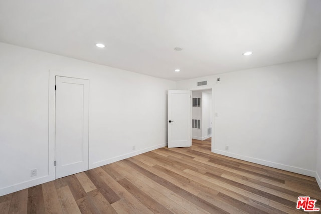 unfurnished room featuring light wood-type flooring