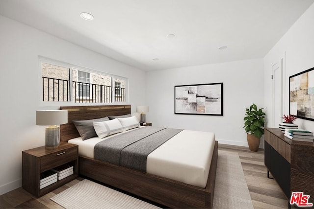 bedroom with wood-type flooring