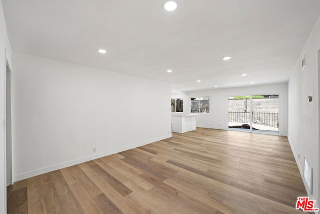 unfurnished living room featuring light hardwood / wood-style flooring