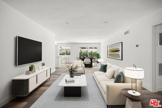 living room featuring dark hardwood / wood-style flooring