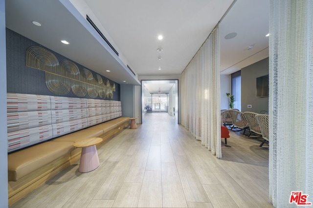 hall with light hardwood / wood-style floors