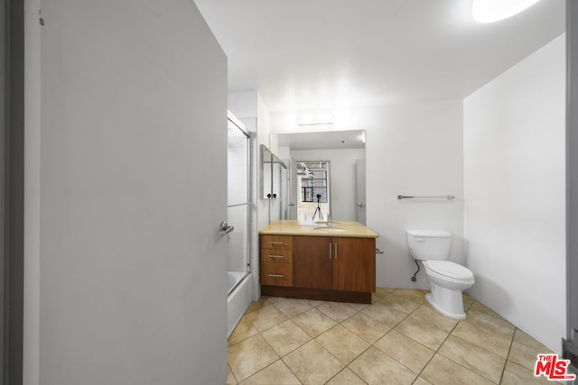 full bathroom with toilet, tile patterned flooring, shower / bathtub combination, and vanity