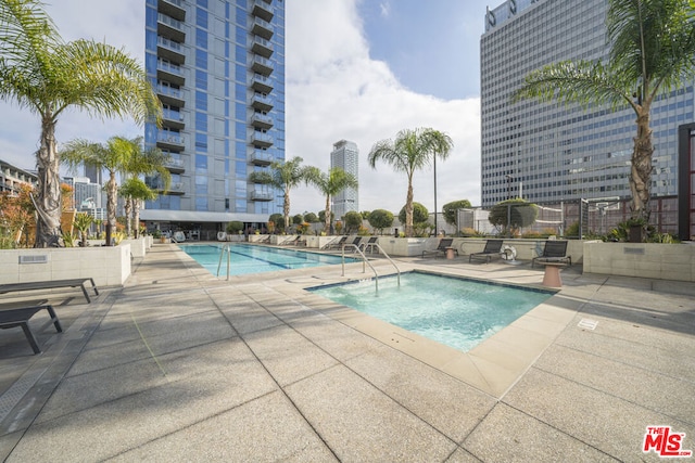 view of swimming pool featuring a patio