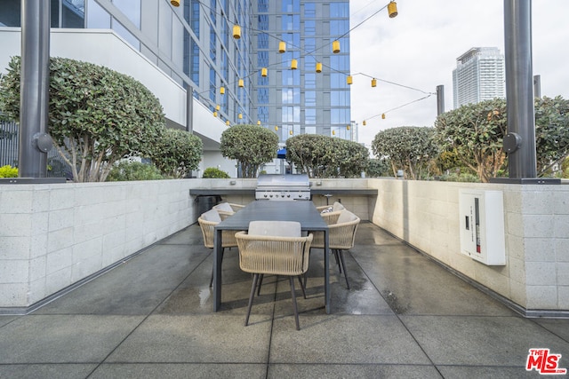 view of patio featuring a grill and an outdoor kitchen