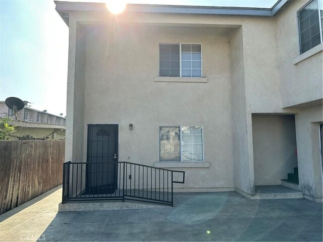 rear view of house featuring a patio