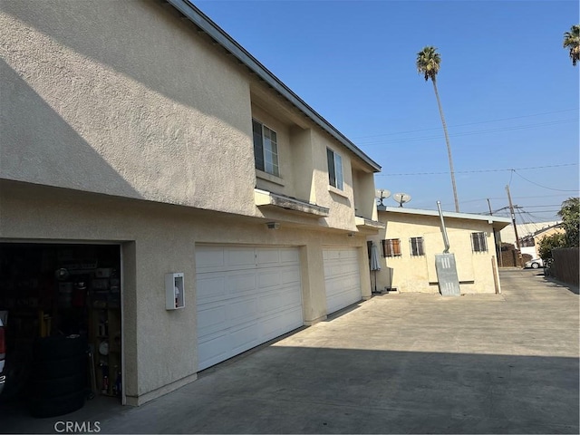 exterior space featuring a garage and electric panel