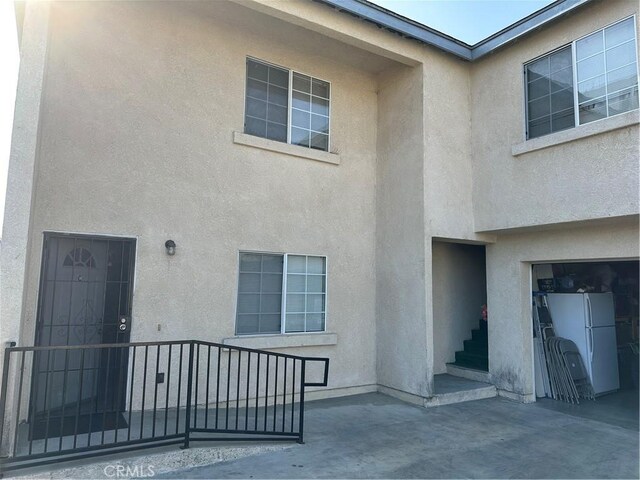 doorway to property featuring a garage