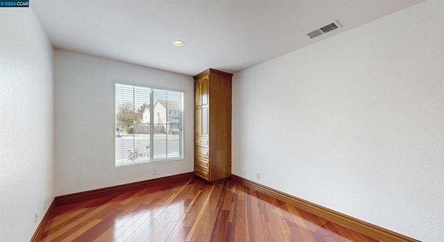 unfurnished room featuring wood-type flooring