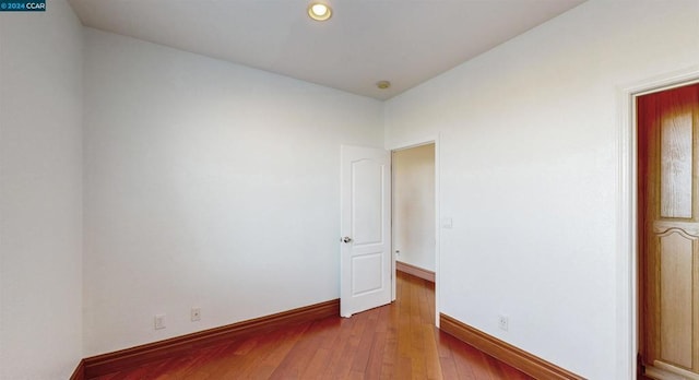 unfurnished room featuring light wood-type flooring