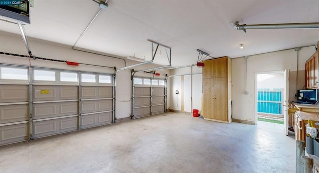 garage featuring a garage door opener