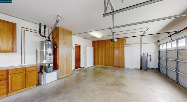 garage featuring secured water heater and a garage door opener