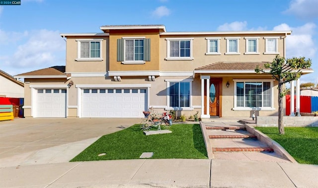 view of front of home with a garage and a front yard