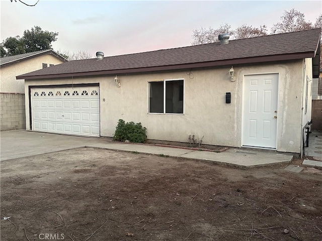 single story home featuring a garage