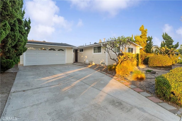 ranch-style home featuring a garage