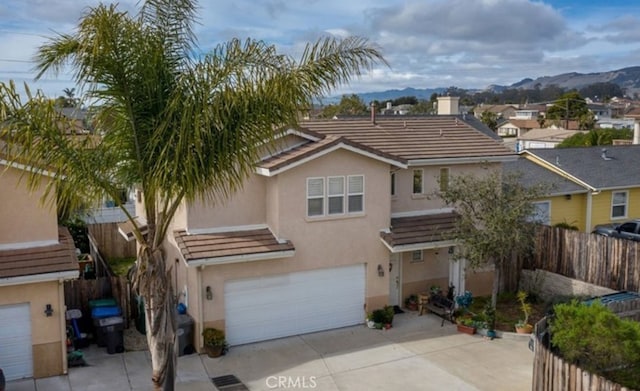 view of front of home featuring a garage and a mountain view