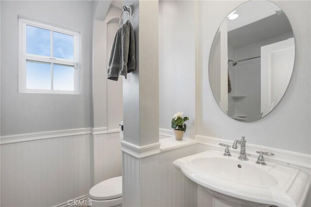 bathroom with sink and toilet