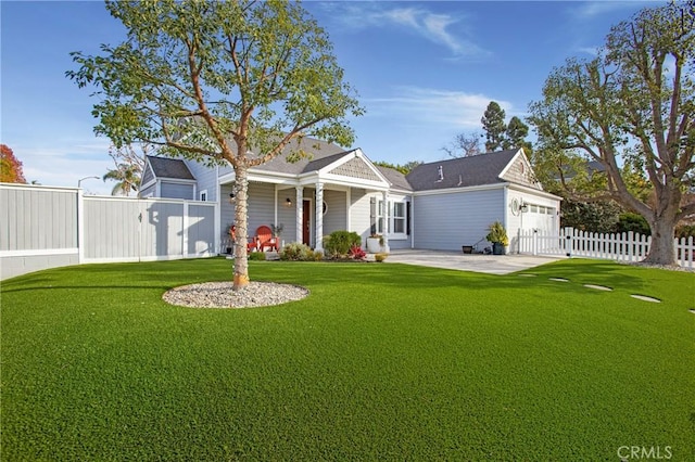 view of front of house with a garage, a front yard, and fence private yard