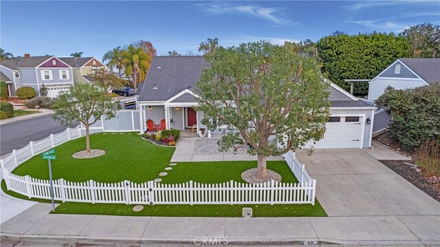 view of front of home featuring a porch, a front yard, and a garage