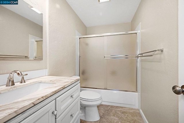 full bathroom with tile patterned flooring, vanity, toilet, and enclosed tub / shower combo