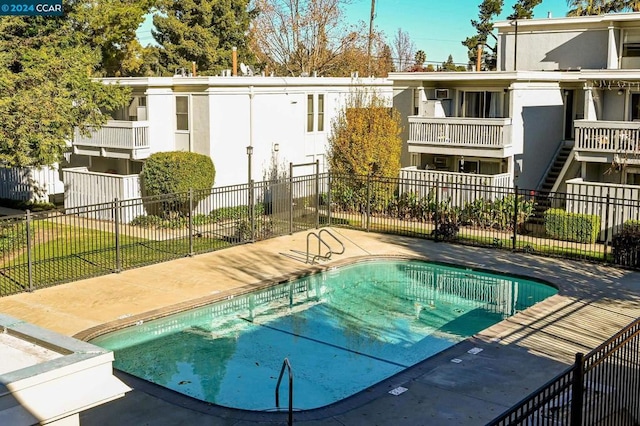 view of pool featuring a patio