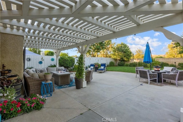 view of patio / terrace with a pergola and an outdoor fire pit