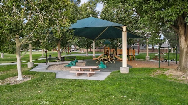 view of home's community with a yard and a playground