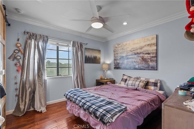 bedroom with dark wood-type flooring, ceiling fan, and crown molding