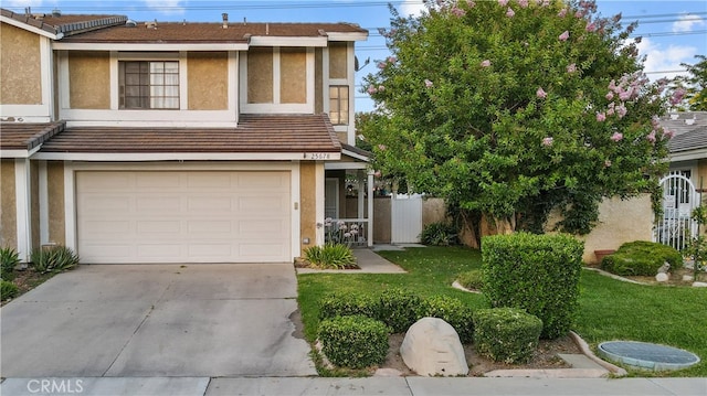 view of front of house with a garage and a front yard