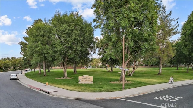 surrounding community featuring a yard