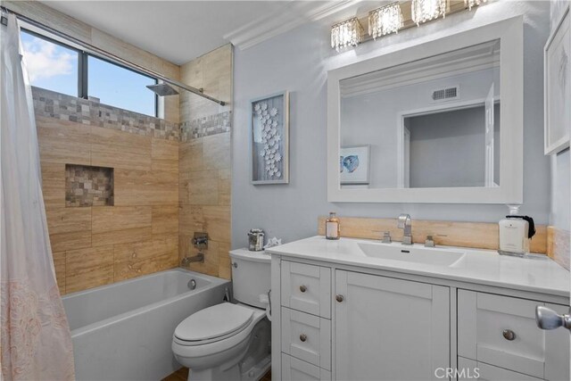 full bathroom featuring vanity, toilet, shower / bathtub combination with curtain, and ornamental molding