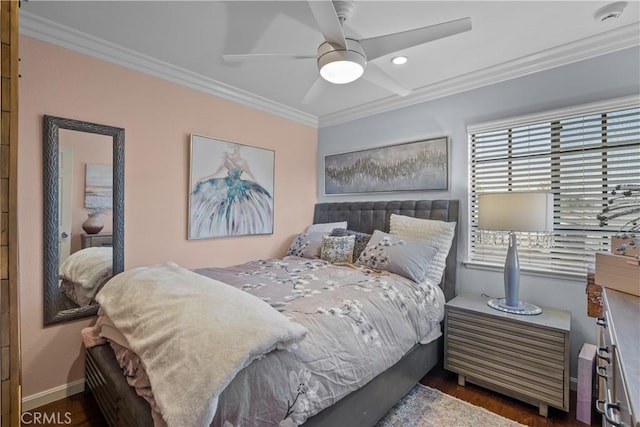 bedroom with ceiling fan, dark hardwood / wood-style flooring, and crown molding