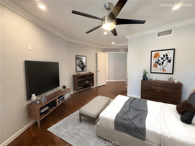 bedroom featuring crown molding, dark wood-type flooring, and ceiling fan