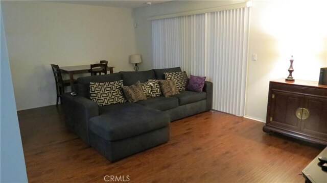 living room featuring dark hardwood / wood-style floors