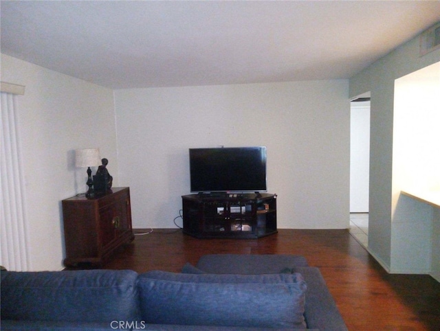 living room with dark hardwood / wood-style flooring